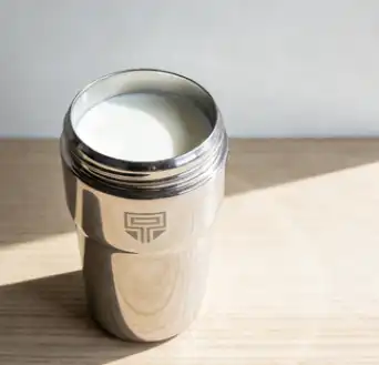 vacuum flask with cold milk